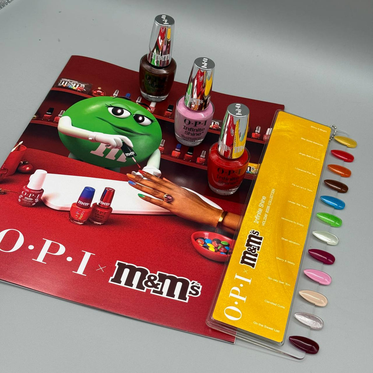 OPI Infinity Shine Sweeten Your Mani x M&M’s Holiday 2026, 12-Piece Display - INFINITE SHINE